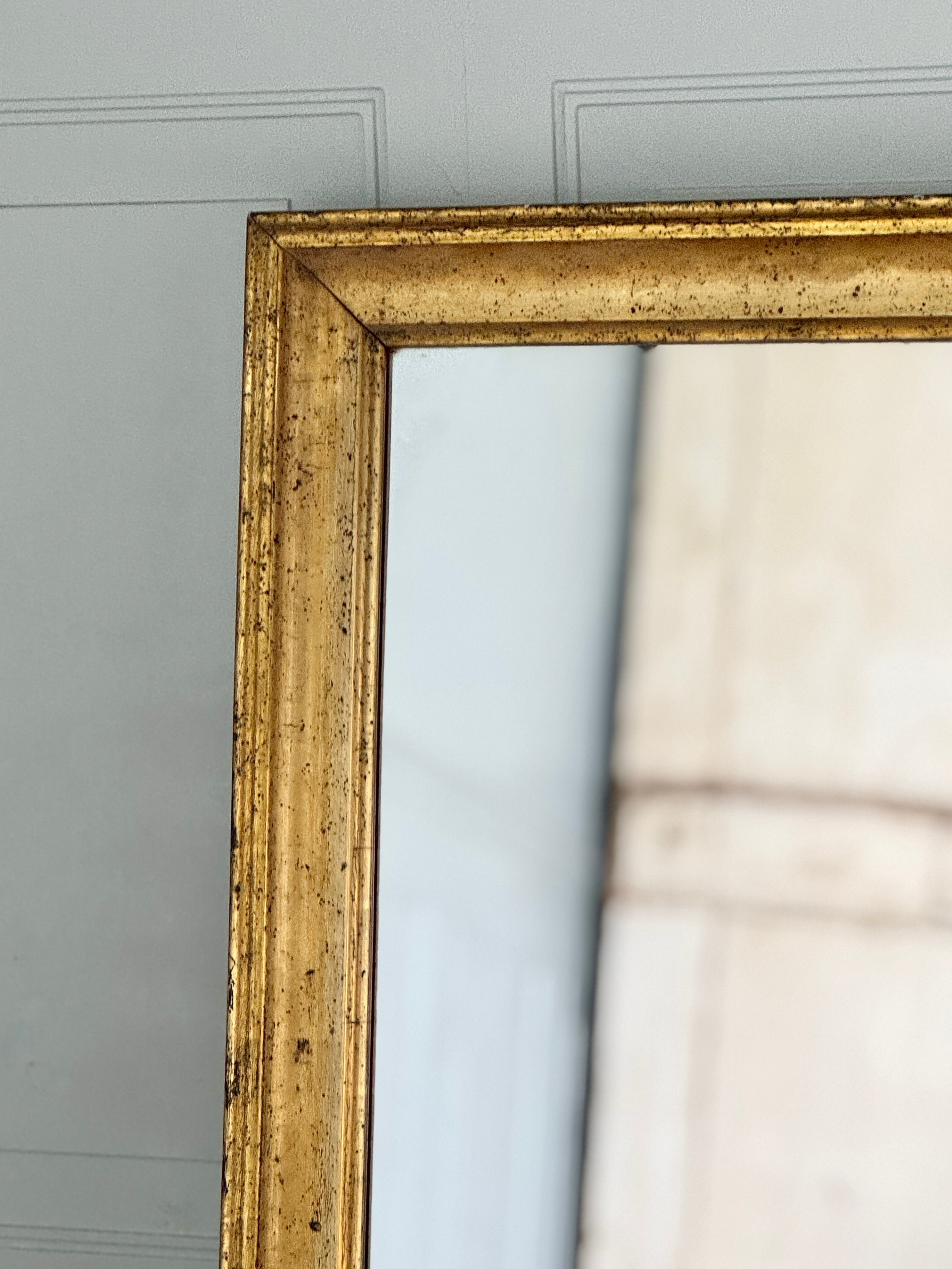 Miroir ancien français doré à patine vieillie